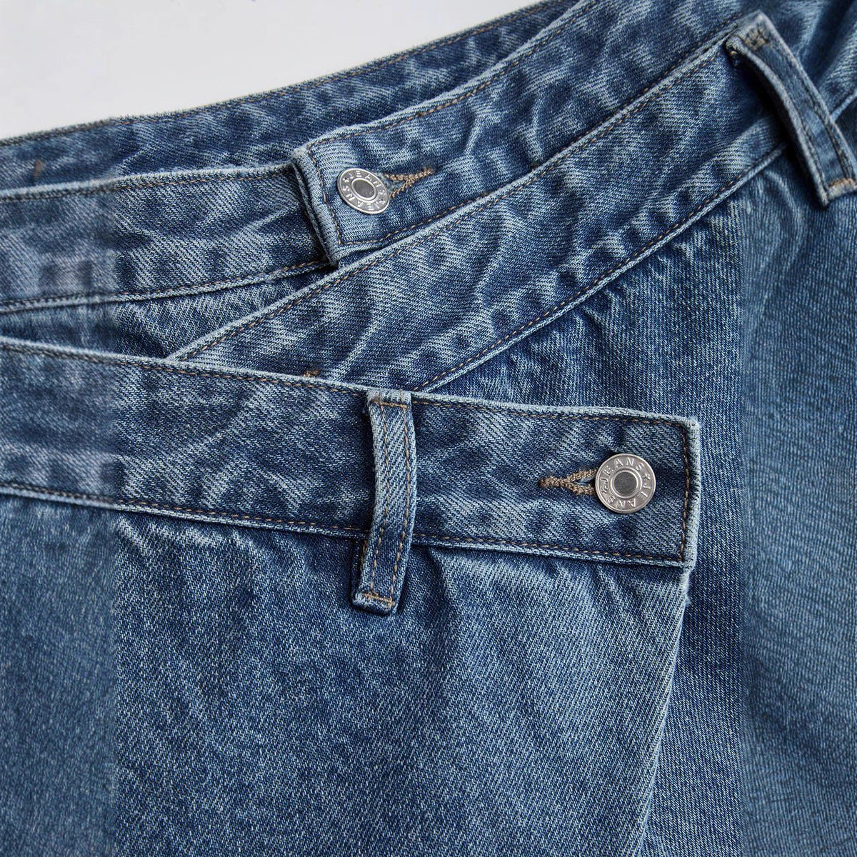 Asymmetrical-seamed Distressed Denim Jeans